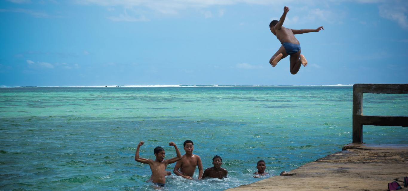 children playing in the sea